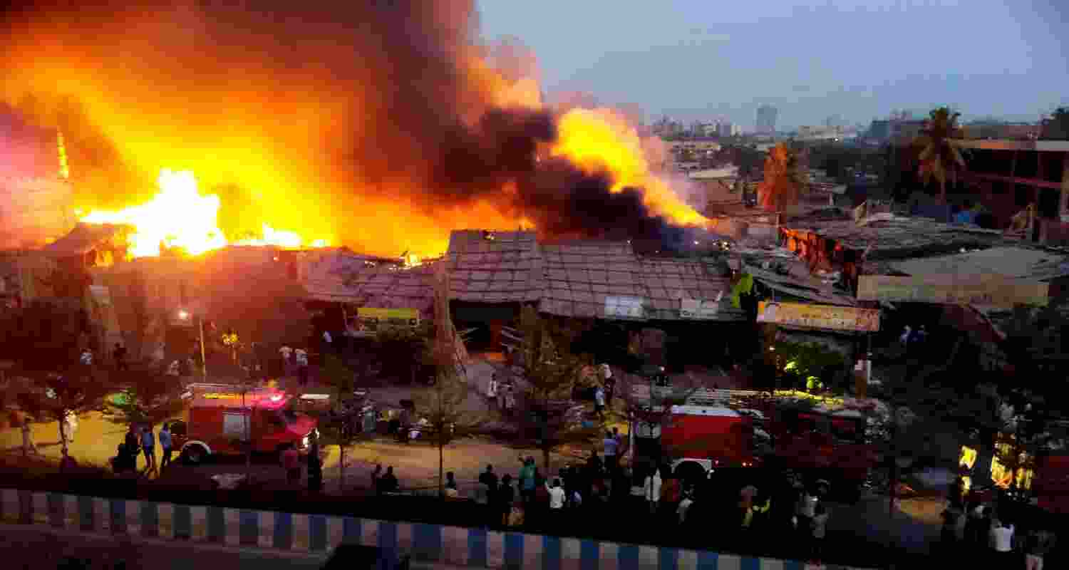 Firefighters at the spot after a fire broke out in a slum, at Bhayandar in Thane district.  Firefighters at the spot after a fire broke out in a slum, at Bhayandar in Thane district.