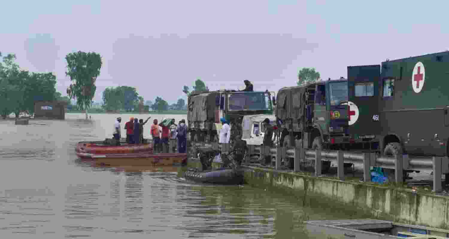 Army personnel carry out a rescue and evacuation operation at a flood-affected village in Punjab. Army personnel carry out a rescue and evacuation operation at a flood-affected village in Punjab.