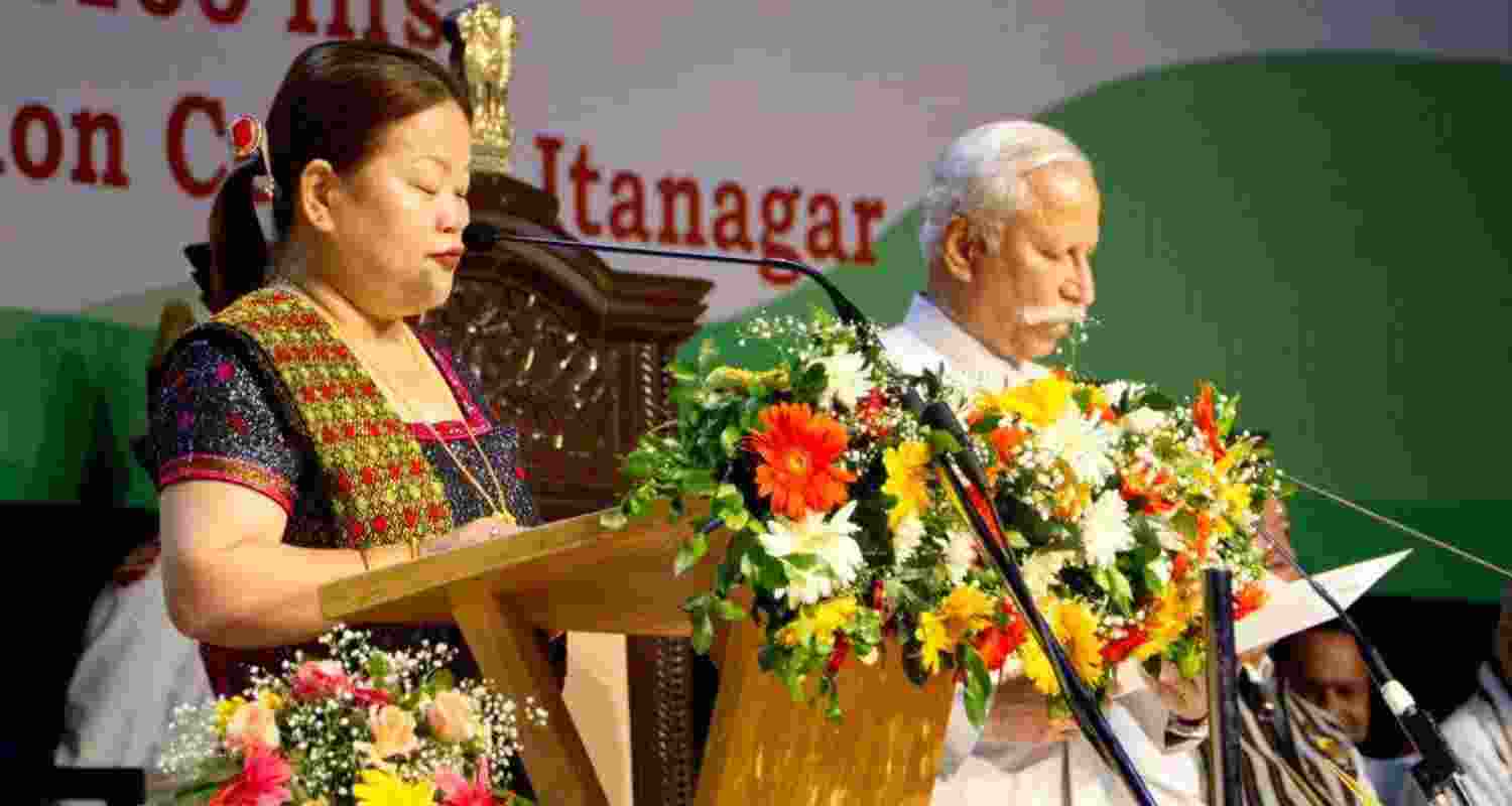 Dasanglu Pul taking oath as a minister in the Arunachal Pradesh government at the Dorjee Khandu Convention Hall in Itanagar on Thursday. Dasanglu Pul taking oath as a minister in the Arunachal Pradesh government at the Dorjee Khandu Convention Hall in Itanagar on Thursday.