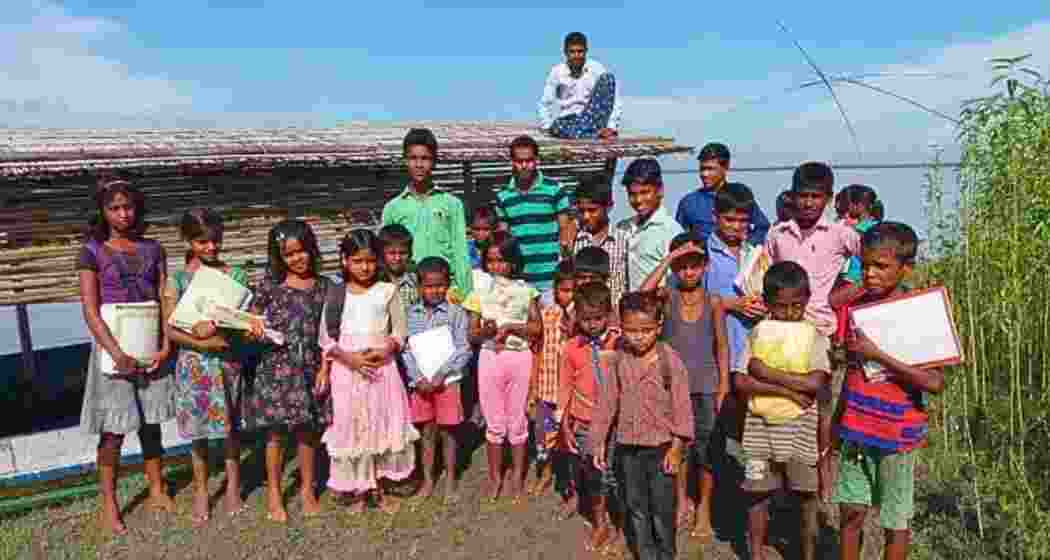 Students stand in front of a “floating school” in Assam. (Photo: Utpal Parashar) Students stand in front of a “floating school” in Assam. (Photo: Utpal Parashar)