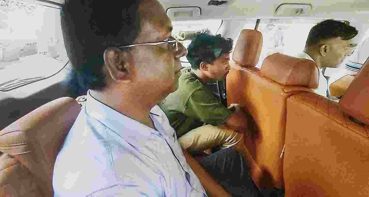 Oasis School Principal Ahsanul Haque being taken for questioning by CBI officials in connection with the alleged NEET paper leak, in Hazaribagh district of Jharkhand, Wednesday.   Oasis School Principal Ahsanul Haque being taken for questioning by CBI officials in connection with the alleged NEET paper leak, in Hazaribagh district of Jharkhand, Wednesday.