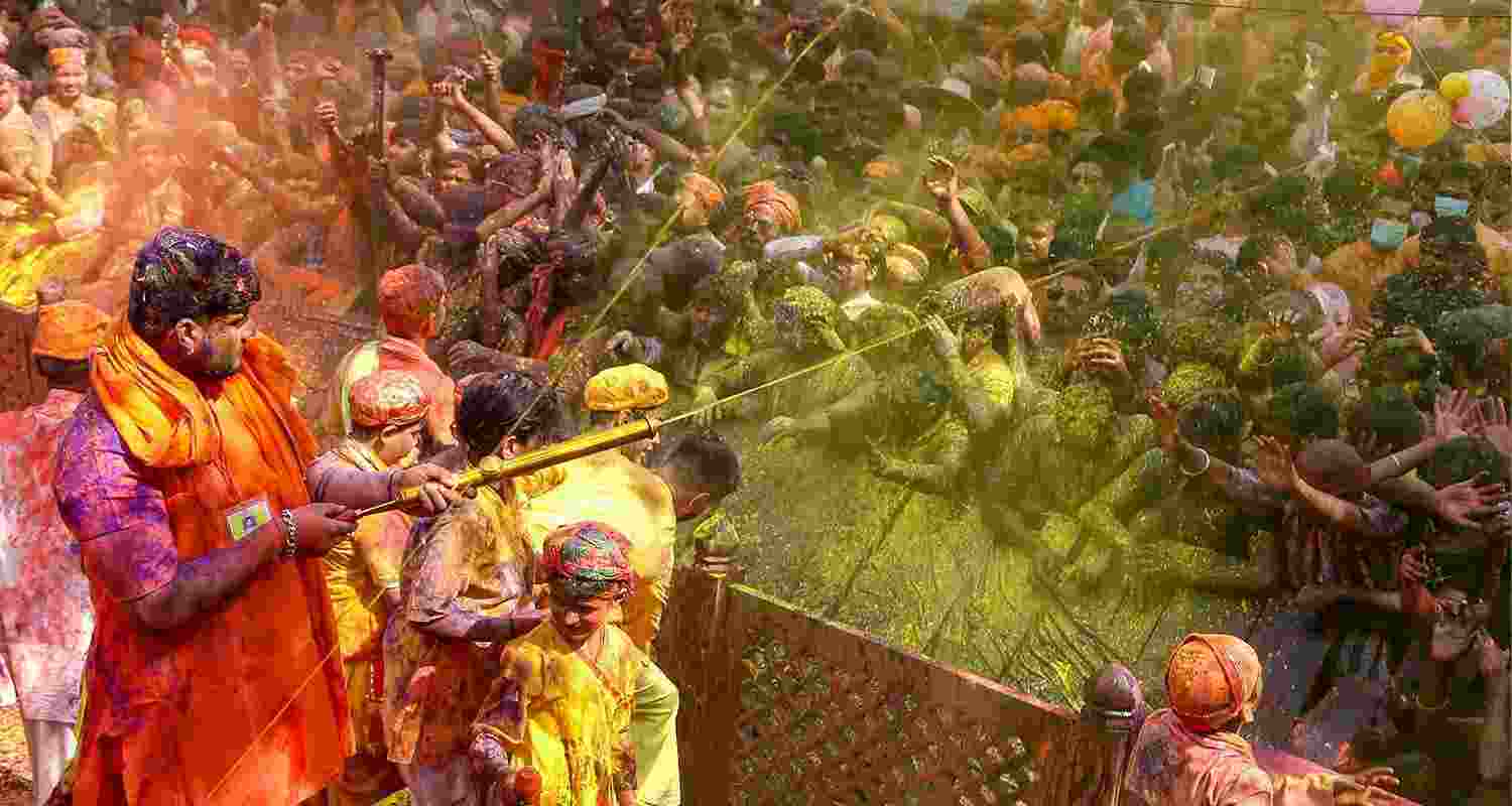 Mathura: Devotees celebrate 'Chadi Maar' Holi in the Gokul town near Mathura, 
 Mathura: Devotees celebrate 'Chadi Maar' Holi in the Gokul town near Mathura,