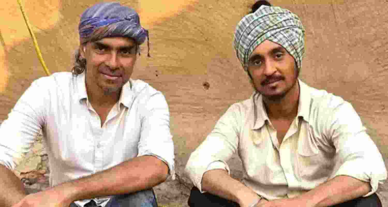 Imtiaz Ali and Diljit Dosanjh during the shooting of 'Amar Singh Chamkila'. Imtiaz Ali and Diljit Dosanjh during the shooting of 'Amar Singh Chamkila'.