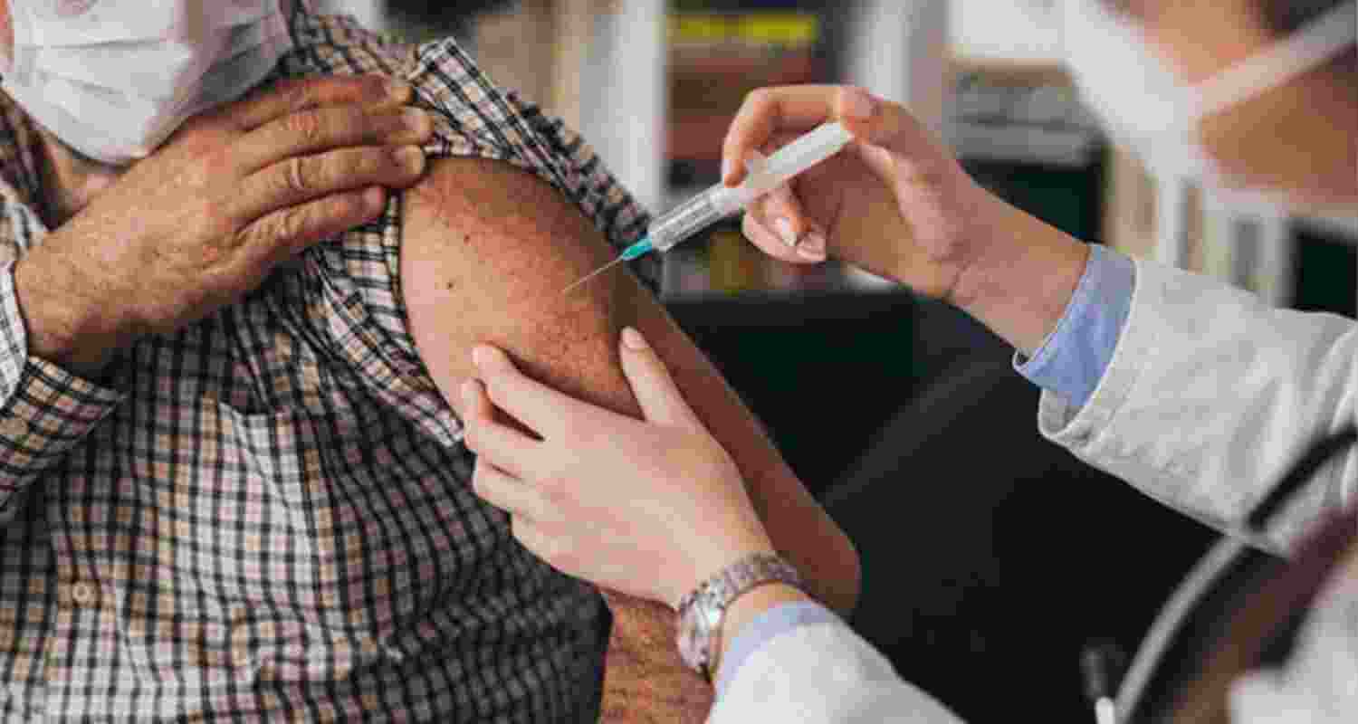 Image of man getting COVID vaccine.  Image of man getting COVID vaccine.