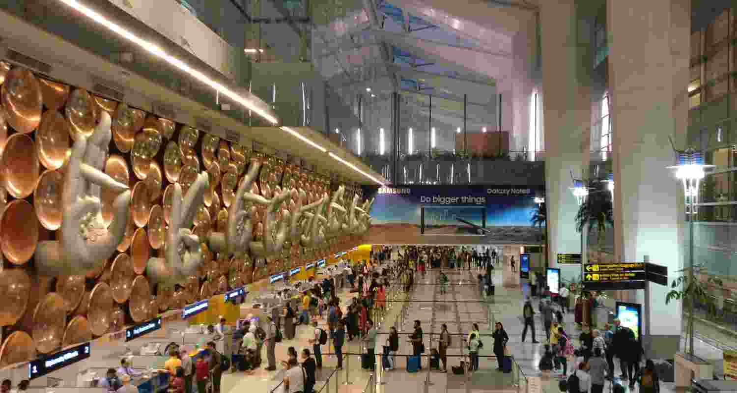 Passengers at the Indira Gandhi International airport in New Delhi. Passengers at the Indira Gandhi International airport in New Delhi.