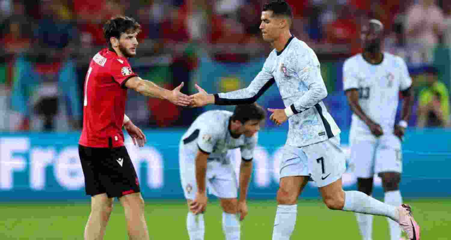 Portugal captain Cristiano Ronaldo and Georgian Striker Khvicha Kvaratskhelia share a moment of mutual appreciation on the field. Portugal captain Cristiano Ronaldo and Georgian Striker Khvicha Kvaratskhelia share a moment of mutual appreciation on the field.