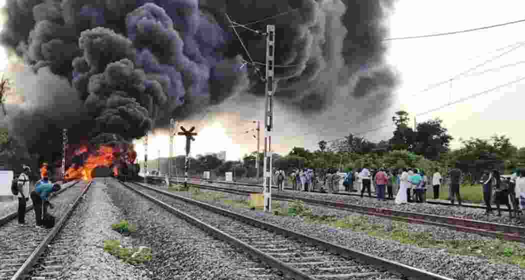 Flames and black smoke engulf a diesel tanker on a goods train near Tiruvallur, disrupting several Chennai-bound services as Southern Railway switches off overhead power.  Flames and black smoke engulf a diesel tanker on a goods train near Tiruvallur, disrupting several Chennai-bound services as Southern Railway switches off overhead power.