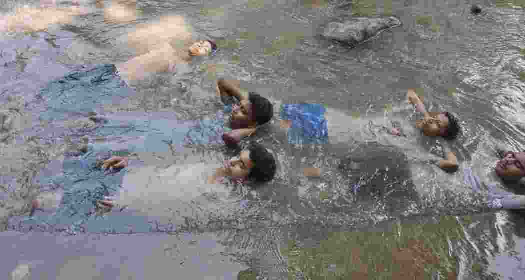 Children trying to beat the heat Children trying to beat the heat