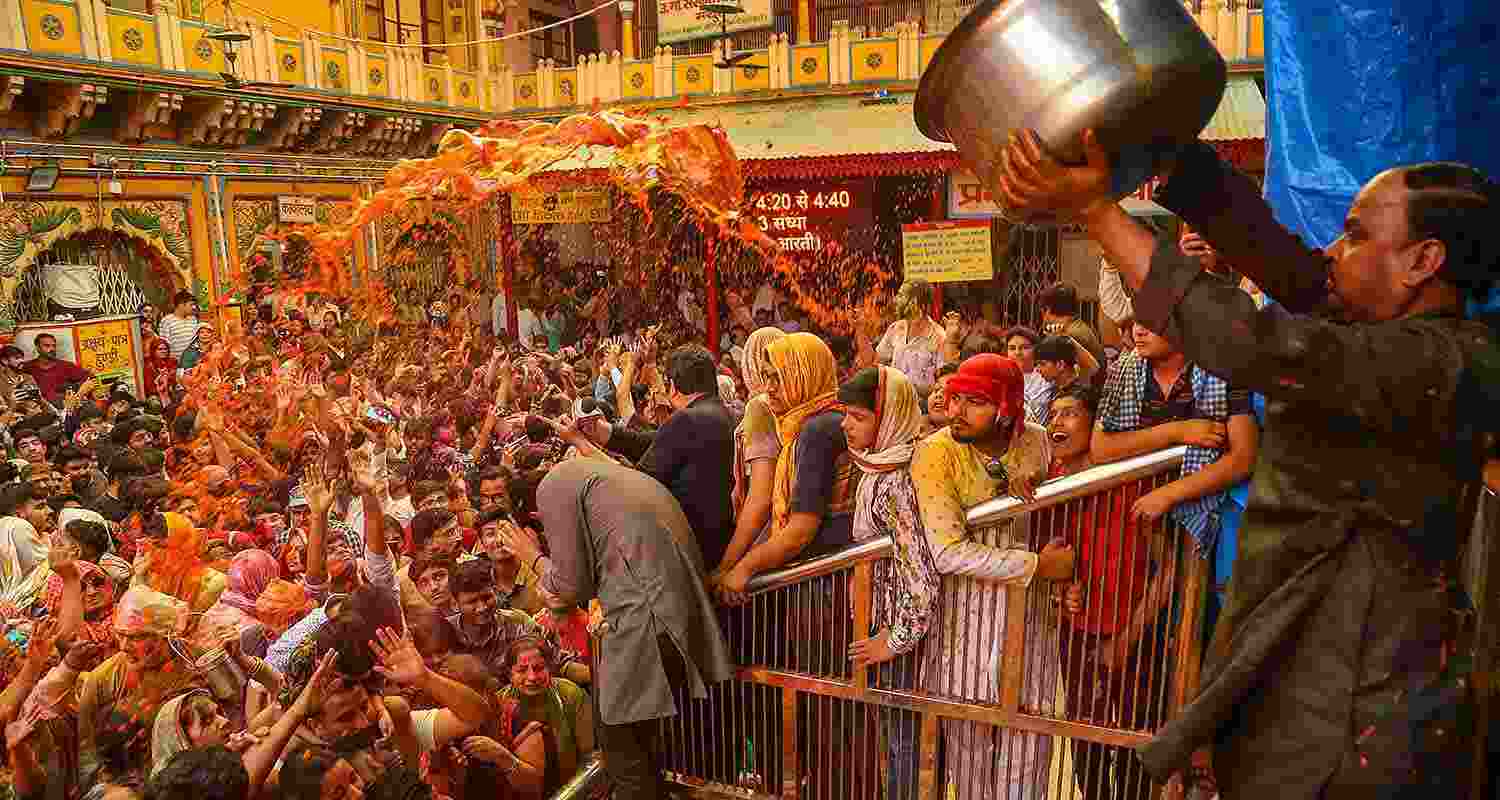 Devotees celebrate with colours during Holi celebration at the Dwarkadhish Temple, in Mathura Devotees celebrate with colours during Holi celebration at the Dwarkadhish Temple, in Mathura