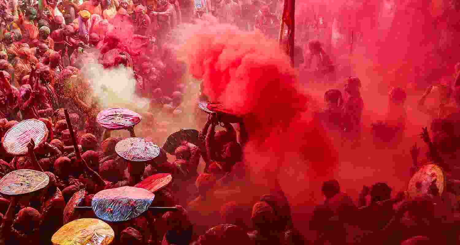 Devotees during Latthamaar Holi celebration at Sri Ji temple at Barsana near Mathura Devotees during Latthamaar Holi celebration at Sri Ji temple at Barsana near Mathura