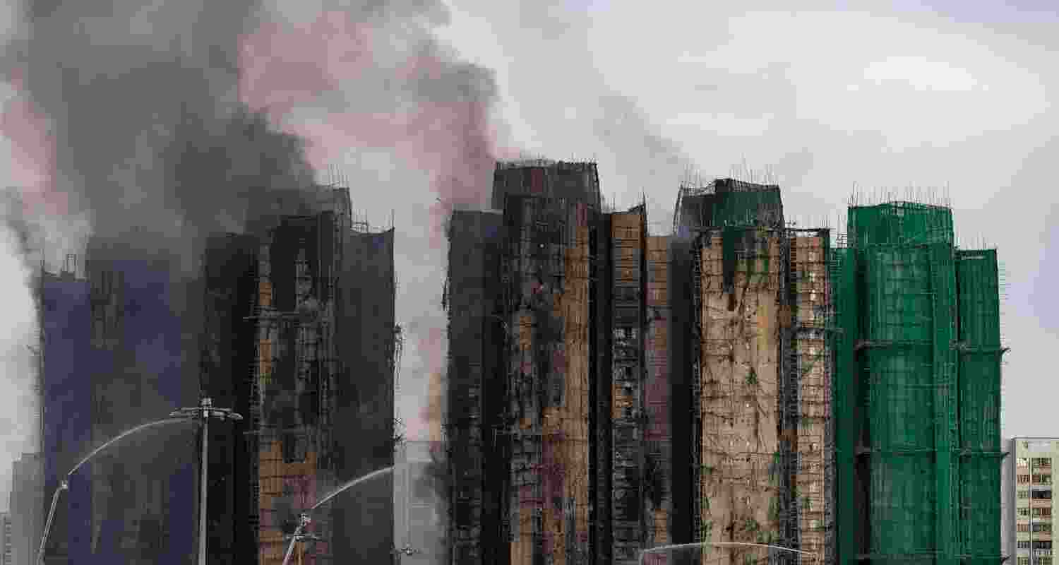 Smoke rises after a fire broke out at Wang Fuk Court, a residential estate in the Tai Po district of Hong Kong. Smoke rises after a fire broke out at Wang Fuk Court, a residential estate in the Tai Po district of Hong Kong.