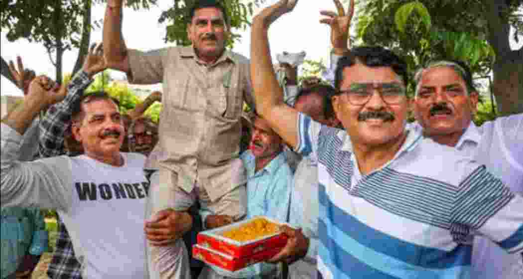 West Pakistani Refugees (WPRs) celebrate after the J&K administration granted proprietary rights to WPRs for land in the union territory, in Jammu on Wednesday.  West Pakistani Refugees (WPRs) celebrate after the J&K administration granted proprietary rights to WPRs for land in the union territory, in Jammu on Wednesday.