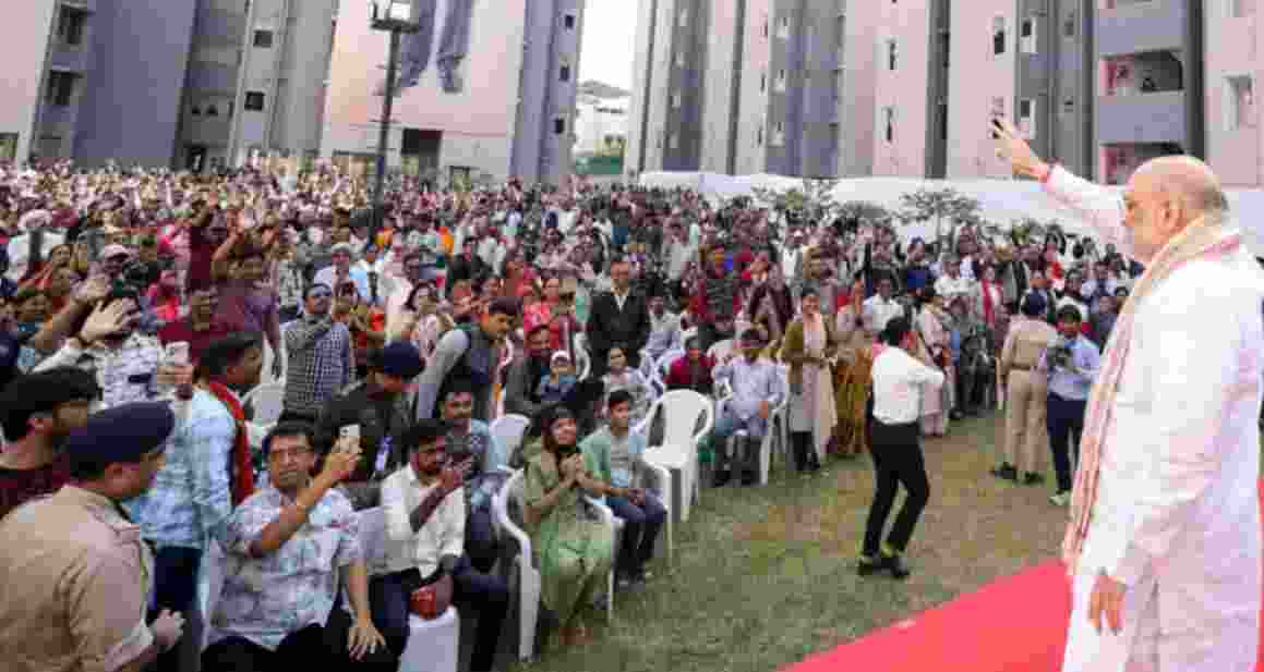Union Home Minister Amit Shah waves to people during the inauguration of 861 newly constructed EWS houses built under the PM Awas Yojana, in Ahmedabad on Sunday. Union Home Minister Amit Shah waves to people during the inauguration of 861 newly constructed EWS houses built under the PM Awas Yojana, in Ahmedabad on Sunday.