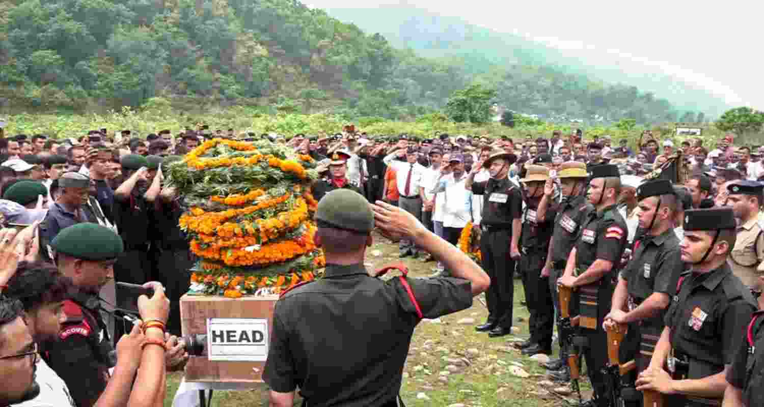 Pauri Garhwal: Army personnel and others pay tribute to the mortal remains of Havaldar Kamal Singh who was martyred in the recent terror attack in Jammu and Kashmir�s Kathua district, at his home, in Pauri Garhwal district. Pauri Garhwal: Army personnel and others pay tribute to the mortal remains of Havaldar Kamal Singh who was martyred in the recent terror attack in Jammu and Kashmir�s Kathua district, at his home, in Pauri Garhwal district.