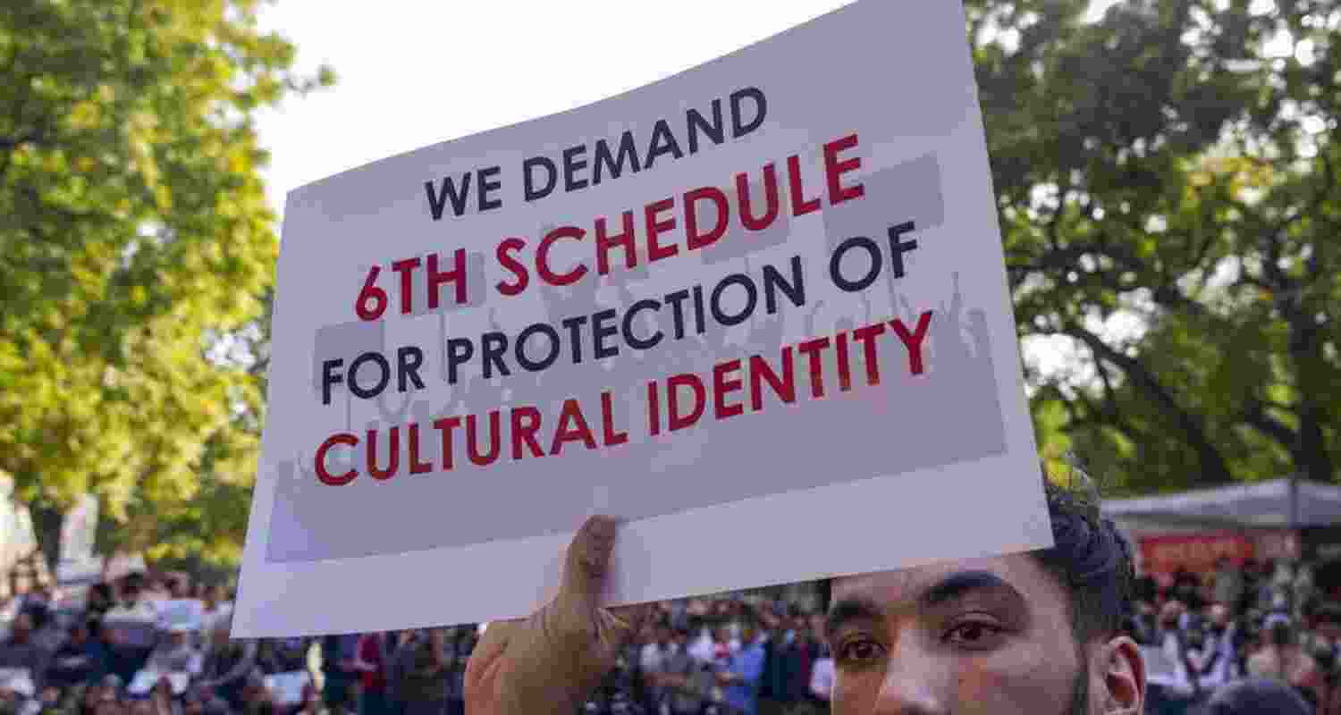 A Ladakhi protestor holding 6th schedule supporting placards in New Delhi. A Ladakhi protestor holding 6th schedule supporting placards in New Delhi.
