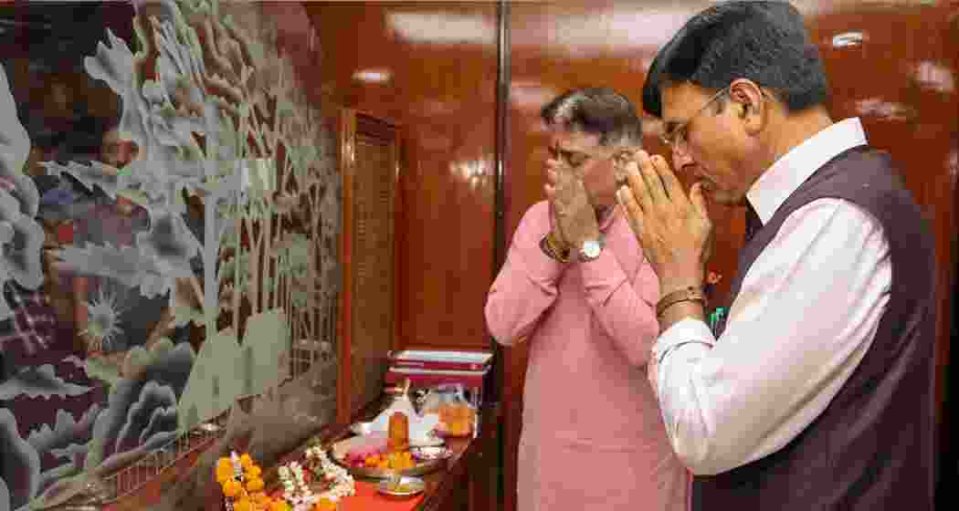 Union Minister Mansukh Mandaviya offers prayers before taking charge as Minister of Labour and Employment, in New Delhi. Union Minister Mansukh Mandaviya offers prayers before taking charge as Minister of Labour and Employment, in New Delhi.
