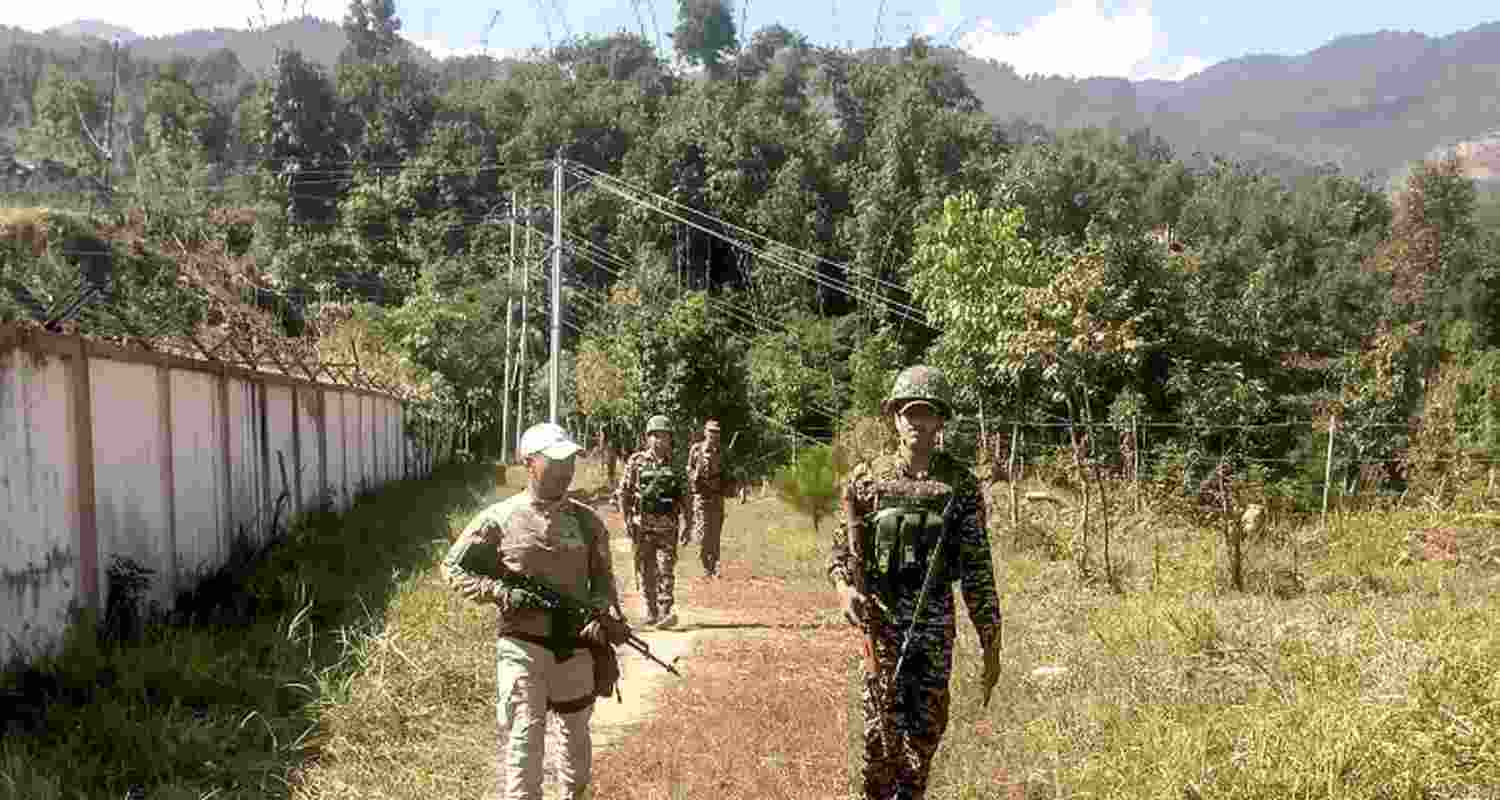 Security personnel patrol in a sensitive area of Manipur. Security personnel patrol in a sensitive area of Manipur.