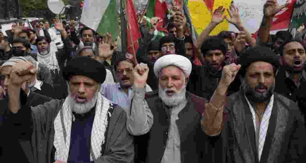Protestors chant slogans to condemn the killing of Shiite Muslims by gunmen in an ambush in Kurram district, during a demonstration in Lahore, Pakistan, Friday, Nov. 22, 2024. Protestors chant slogans to condemn the killing of Shiite Muslims by gunmen in an ambush in Kurram district, during a demonstration in Lahore, Pakistan, Friday, Nov. 22, 2024.