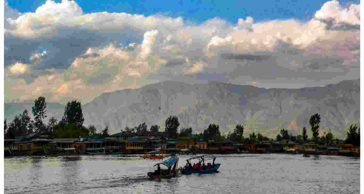 Tourists ride 'Shikaras' at the Dal Lake, seen a day after the Pahalgam terror attack, in Srinagar, Wednesday, April 23.  Tourists ride 'Shikaras' at the Dal Lake, seen a day after the Pahalgam terror attack, in Srinagar, Wednesday, April 23.