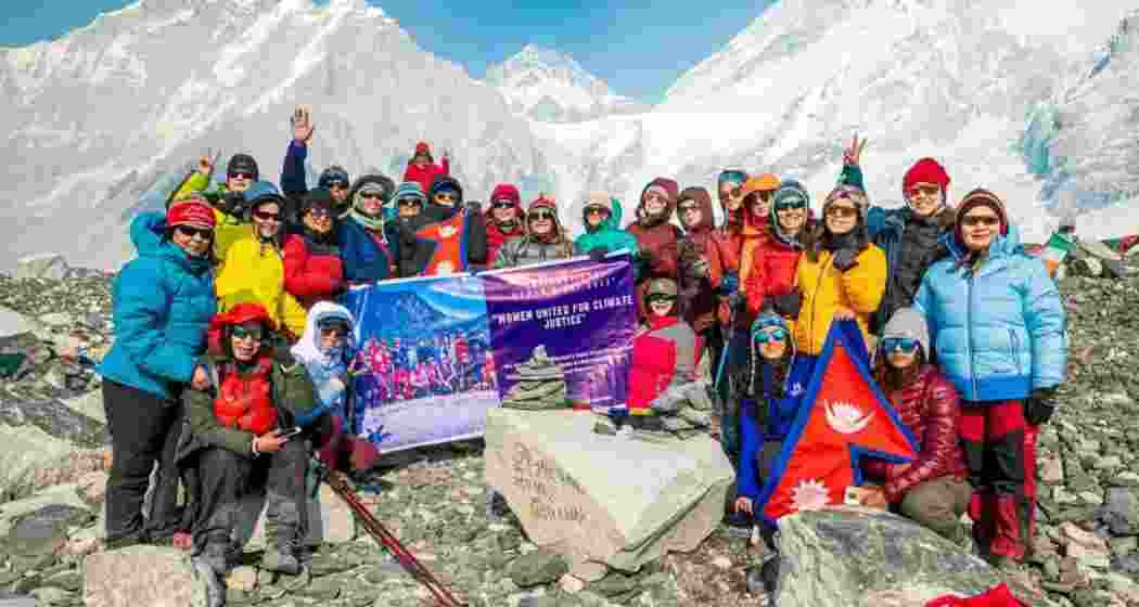 The team, comprising only women, gathers to pose for a photograph as they continue their trek to Mount Everest Base Camp. The team, comprising only women, gathers to pose for a photograph as they continue their trek to Mount Everest Base Camp.