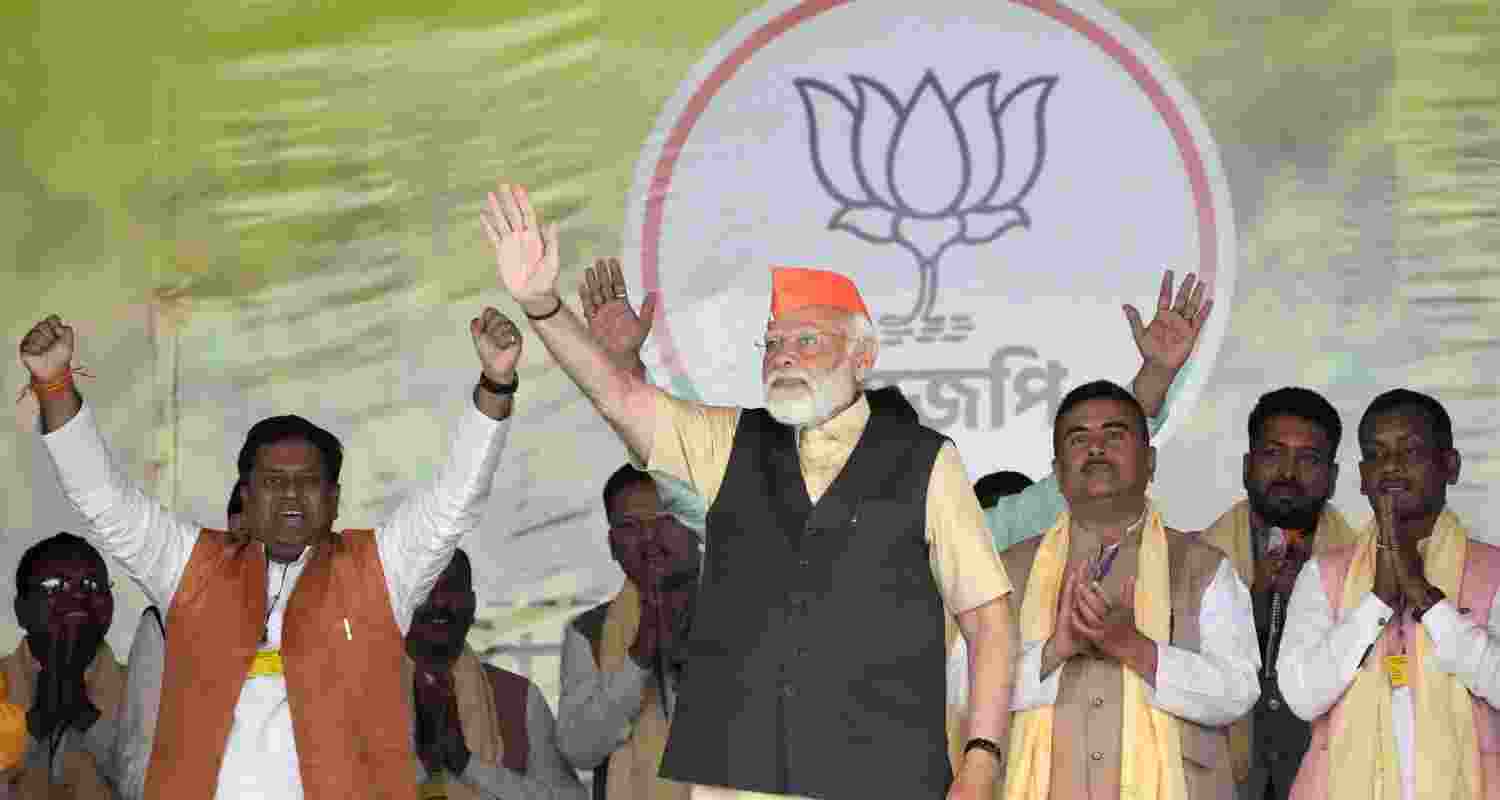 Prime Minister Narendra Modi waves during a public meeting at Kawakhali Ground in Siliguri, on Saturday. Prime Minister Narendra Modi waves during a public meeting at Kawakhali Ground in Siliguri, on Saturday.