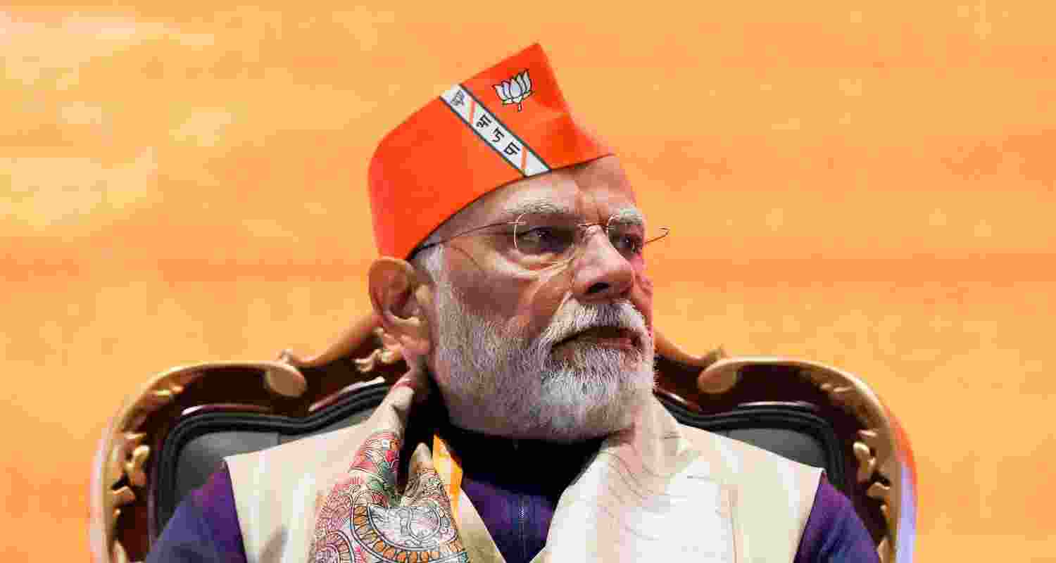 PM modi wearing a BJP cap during the party's national council meeting, PM modi wearing a BJP cap during the party's national council meeting,