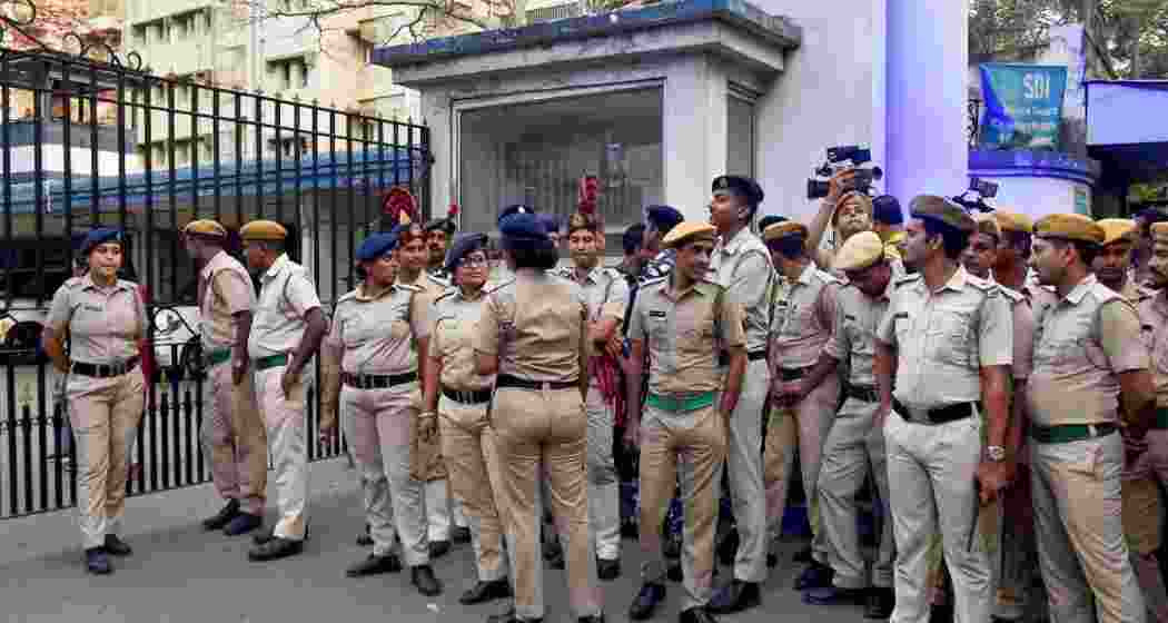 Security personnel stand guard outside Bhavani Bhawan (West Bengal Police headquarters) where CBI officials arrived to take TMC's Sheikh Shahjahan, accused in the Sandeshkhali case Security personnel stand guard outside Bhavani Bhawan (West Bengal Police headquarters) where CBI officials arrived to take TMC's Sheikh Shahjahan, accused in the Sandeshkhali case