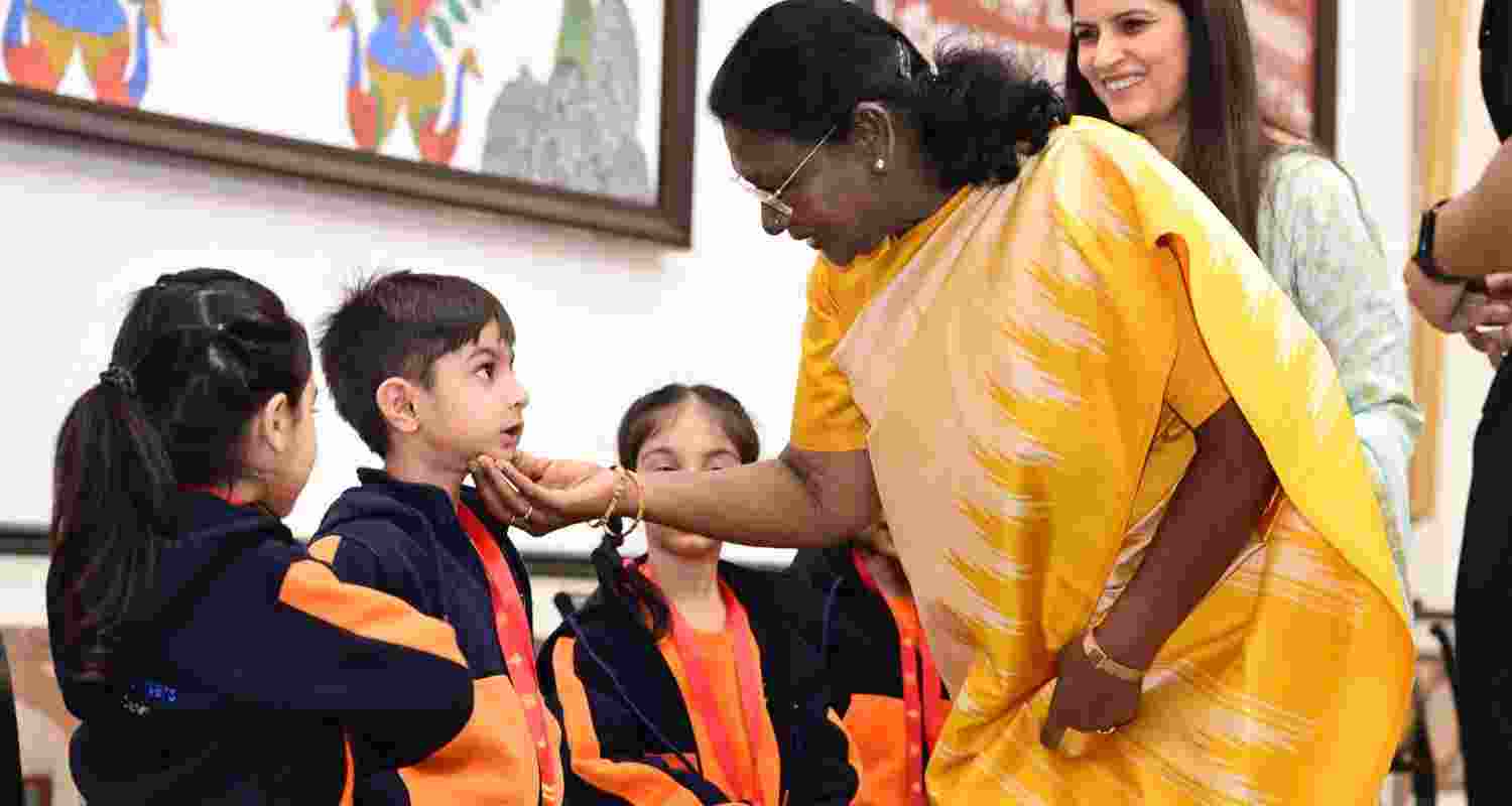 President Murmu meets students on Children's Day at Rashtrapati Bhavan. President Murmu meets students on Children's Day at Rashtrapati Bhavan.