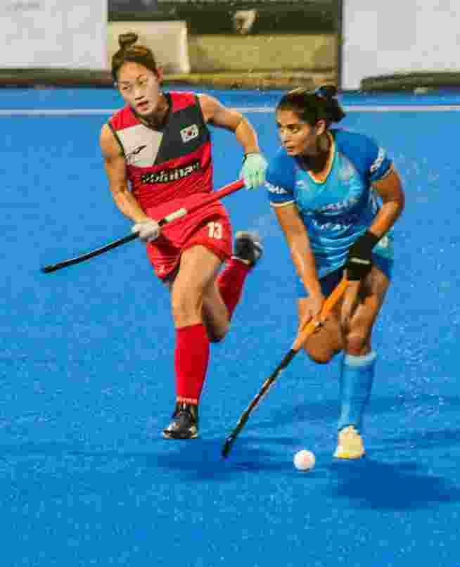 Indian, in blue, and South Korean players vie for the ball during their Women's Asian Champions Trophy 2024 hockey match, at Rajgir, in Nalanda district, Bihar, Tuesday, Nov. 12, 2024. Indian, in blue, and South Korean players vie for the ball during their Women's Asian Champions Trophy 2024 hockey match, at Rajgir, in Nalanda district, Bihar, Tuesday, Nov. 12, 2024.