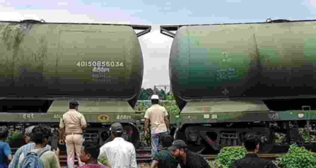 Railway personnel check the tracks after a goods train wagon derailed near Rangapani station in West Bengal's New Jalpaiguri Rail Division on Wednesday. Railway personnel check the tracks after a goods train wagon derailed near Rangapani station in West Bengal's New Jalpaiguri Rail Division on Wednesday.