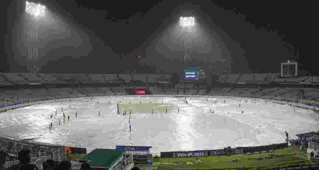 Ground staff covers the field after rain stopped play during an Indian Premier League (IPL) 2025 T20 cricket match between Kolkata Knight Riders and Punjab Kings, at the Eden Gardens stadium, in Kolkata, West Bengal, Saturday, April 26, 2025.  Ground staff covers the field after rain stopped play during an Indian Premier League (IPL) 2025 T20 cricket match between Kolkata Knight Riders and Punjab Kings, at the Eden Gardens stadium, in Kolkata, West Bengal, Saturday, April 26, 2025.