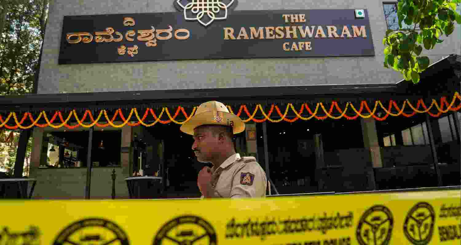 A policeman stands vigilant outside the damaged premises of the Rameshwaram cafe in Bengaluru. A policeman stands vigilant outside the damaged premises of the Rameshwaram cafe in Bengaluru.
