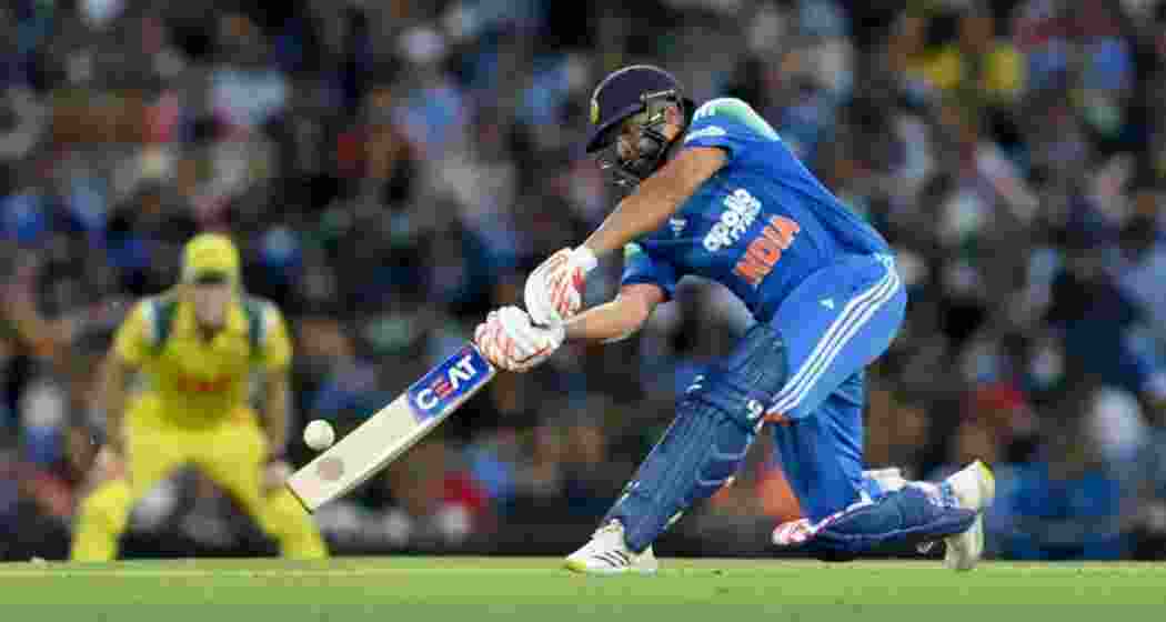 Rohit Sharma in action during an ODI match, celebrating after hitting a record-breaking six to surpass Shahid Afridi’s tally for the most sixes in One-Day International cricket. Rohit Sharma in action during an ODI match, celebrating after hitting a record-breaking six to surpass Shahid Afridi’s tally for the most sixes in One-Day International cricket.