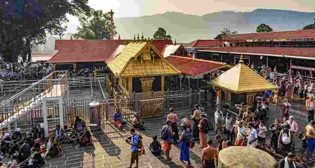People gather outside the Sabarimala Temple. People gather outside the Sabarimala Temple.