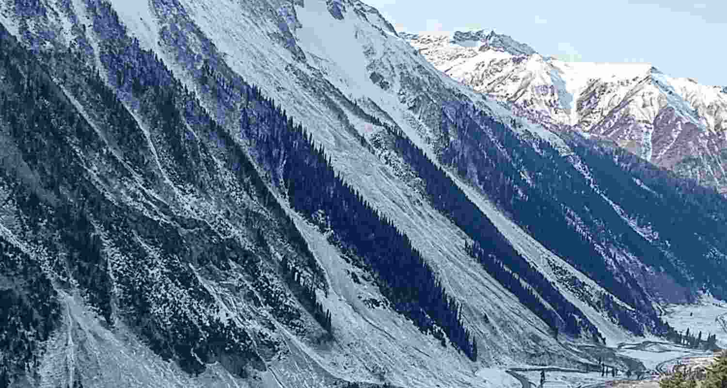 People walk along the Amarnath track as fresh snowfall blankets the area, in Baltal, Jammu and Kashmir, Sunday. People walk along the Amarnath track as fresh snowfall blankets the area, in Baltal, Jammu and Kashmir, Sunday.