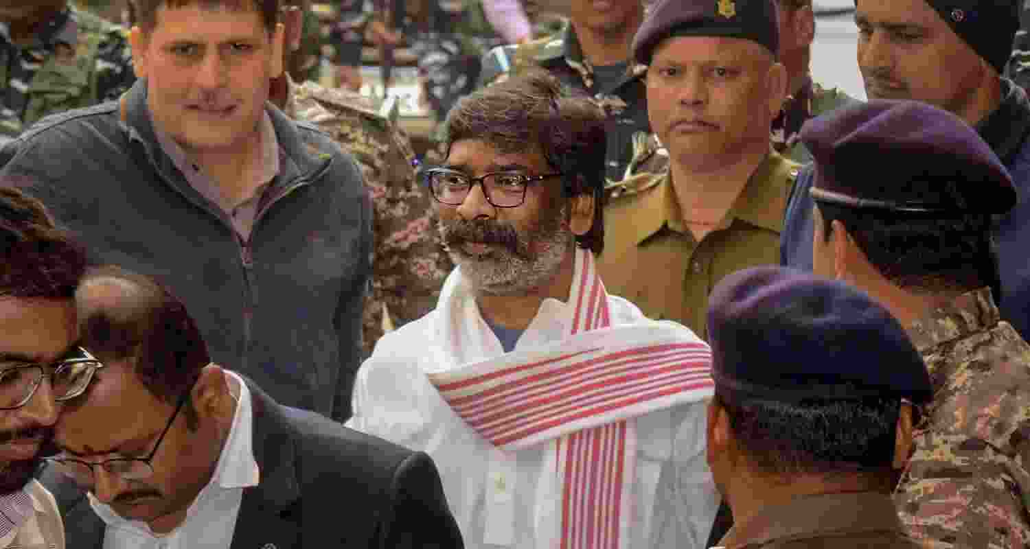 Hemant Soren being taken by security officials to a Ranchi court. Hemant Soren being taken by security officials to a Ranchi court.