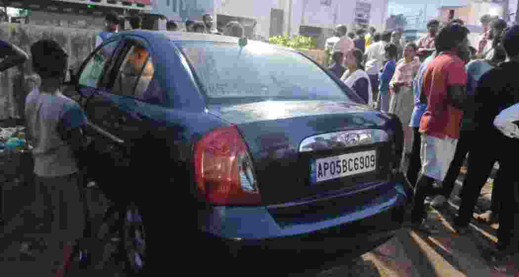 Locals at the scene where four children tragically died after being locked inside a stationary car in Vizianagaram, Andhra Pradesh, on Sunday. Locals at the scene where four children tragically died after being locked inside a stationary car in Vizianagaram, Andhra Pradesh, on Sunday.