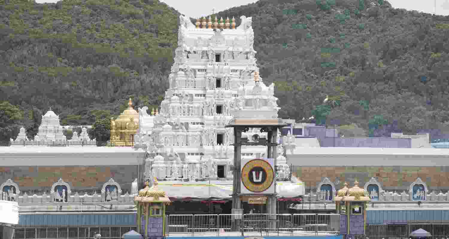 Tirupati Temple in Tirumala, Andhra Pradesh is seen with a crowd of devotees and the backdrop of mountains Tirupati Temple in Tirumala, Andhra Pradesh is seen with a crowd of devotees and the backdrop of mountains