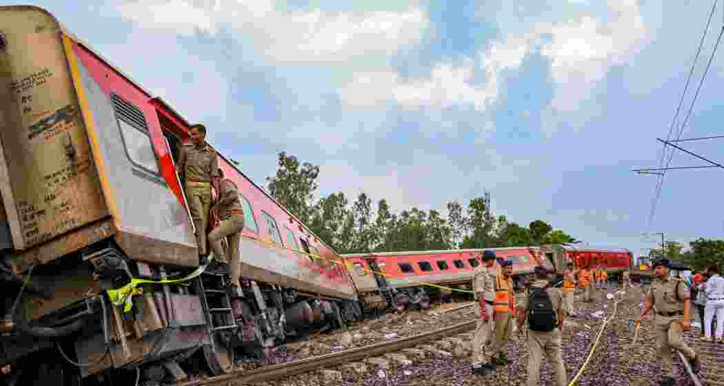 Police personnel inspect the derailed coaches of the Chandigarh-Dibrugarh Express, in Gonda district, Thursday, July 18, 2024. At least four passengers were killed and about 20 injured in the incident, according to officials. Police personnel inspect the derailed coaches of the Chandigarh-Dibrugarh Express, in Gonda district, Thursday, July 18, 2024. At least four passengers were killed and about 20 injured in the incident, according to officials.