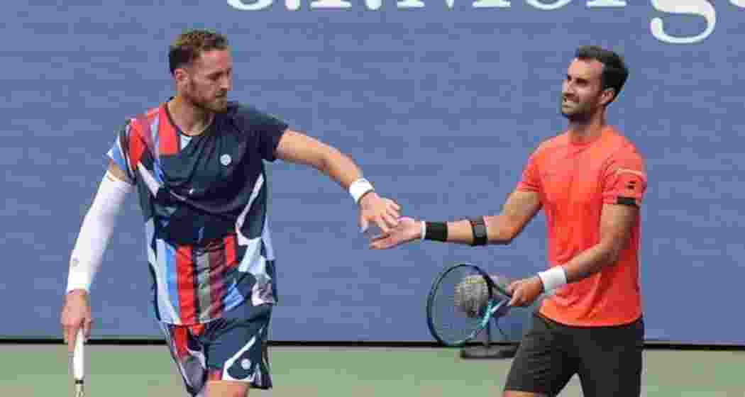 Bhambri-Olivetti in action during their win in US Open Round 1. Bhambri-Olivetti in action during their win in US Open Round 1.