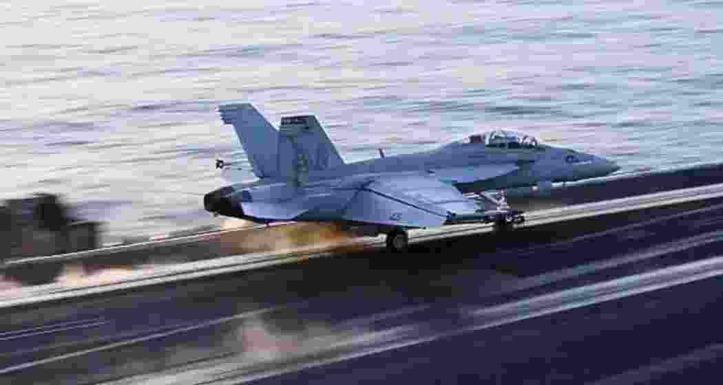 A US Navy fighter jet launches from the USS Harry S. Truman in the Red Sea ahead of airstrikes on Houthi targets in Sanaa, Yemen, on March 15.  A US Navy fighter jet launches from the USS Harry S. Truman in the Red Sea ahead of airstrikes on Houthi targets in Sanaa, Yemen, on March 15.