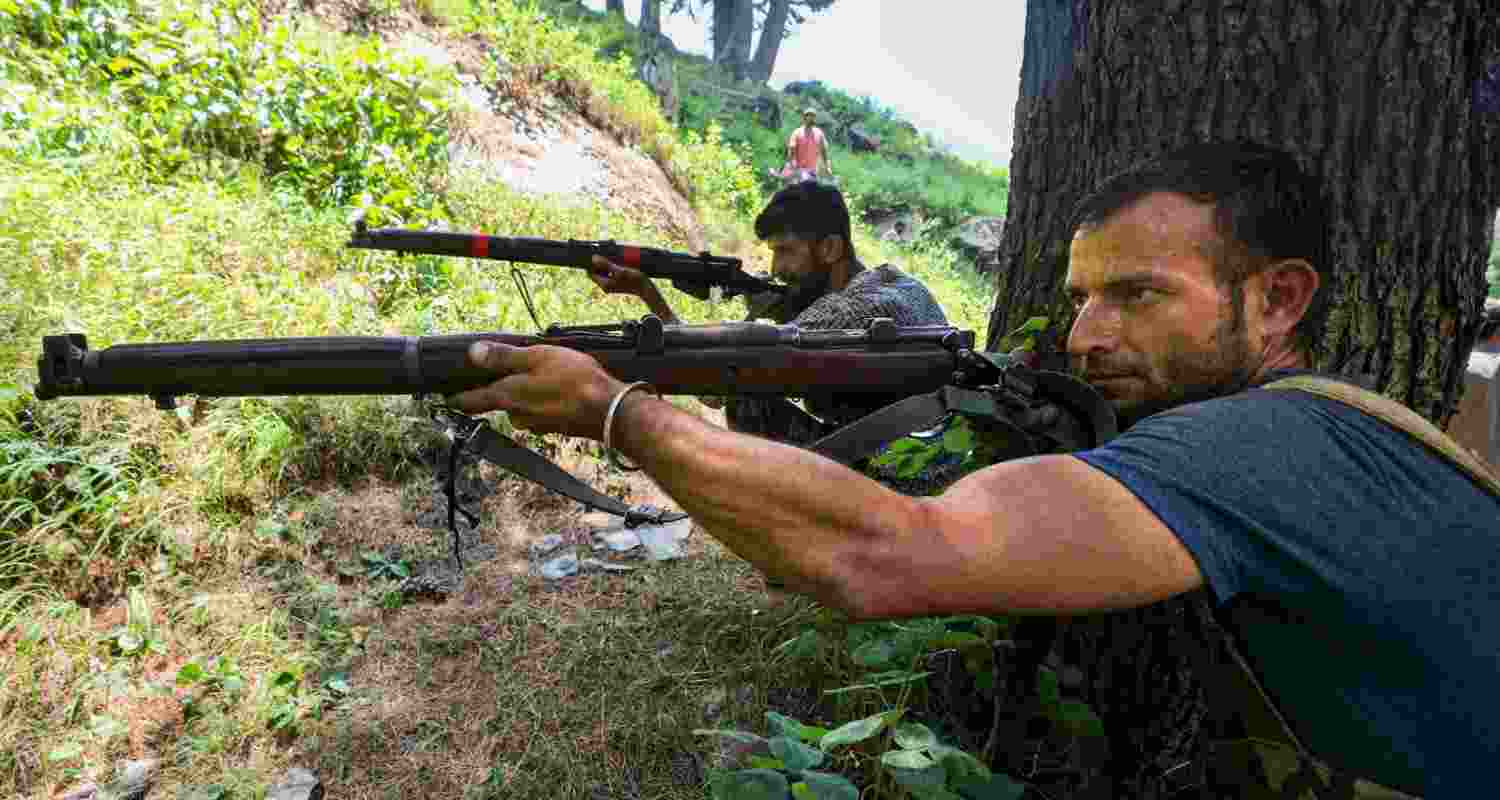 Village Defence Guards keep vigil at a forest area near the encounter site, in Desa area of Doda district, Jammu and Kashmir, Wednesday, July 17, 2024.  Village Defence Guards keep vigil at a forest area near the encounter site, in Desa area of Doda district, Jammu and Kashmir, Wednesday, July 17, 2024.