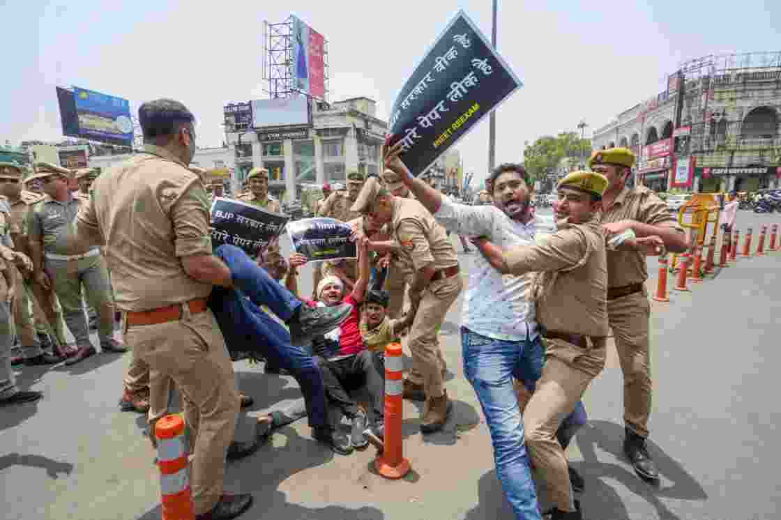 Police personnel detain Samajwadi Party members during a protest against the Central Government over the cancellation of UGC-NET 2024 exam, in Lucknow, Thursday. Police personnel detain Samajwadi Party members during a protest against the Central Government over the cancellation of UGC-NET 2024 exam, in Lucknow, Thursday.