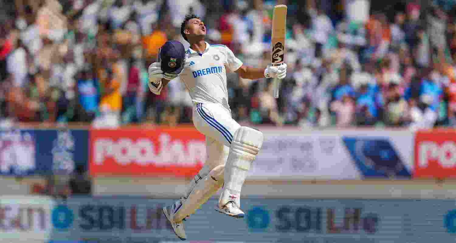 Yashasvi Jaiswal leaps in the air and pumps up his bat to celebrate his double century. Yashasvi Jaiswal leaps in the air and pumps up his bat to celebrate his double century.