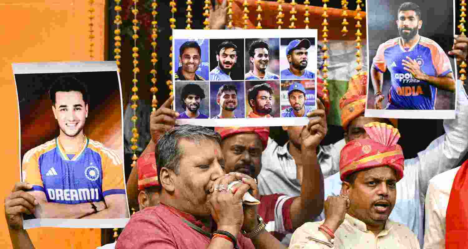People hold posters of the Indian cricket team, praying for India's victory in the ICC Men's T20 World Cup 2026 final against New Zealand, in Patna, Sunday. People hold posters of the Indian cricket team, praying for India's victory in the ICC Men's T20 World Cup 2026 final against New Zealand, in Patna, Sunday.