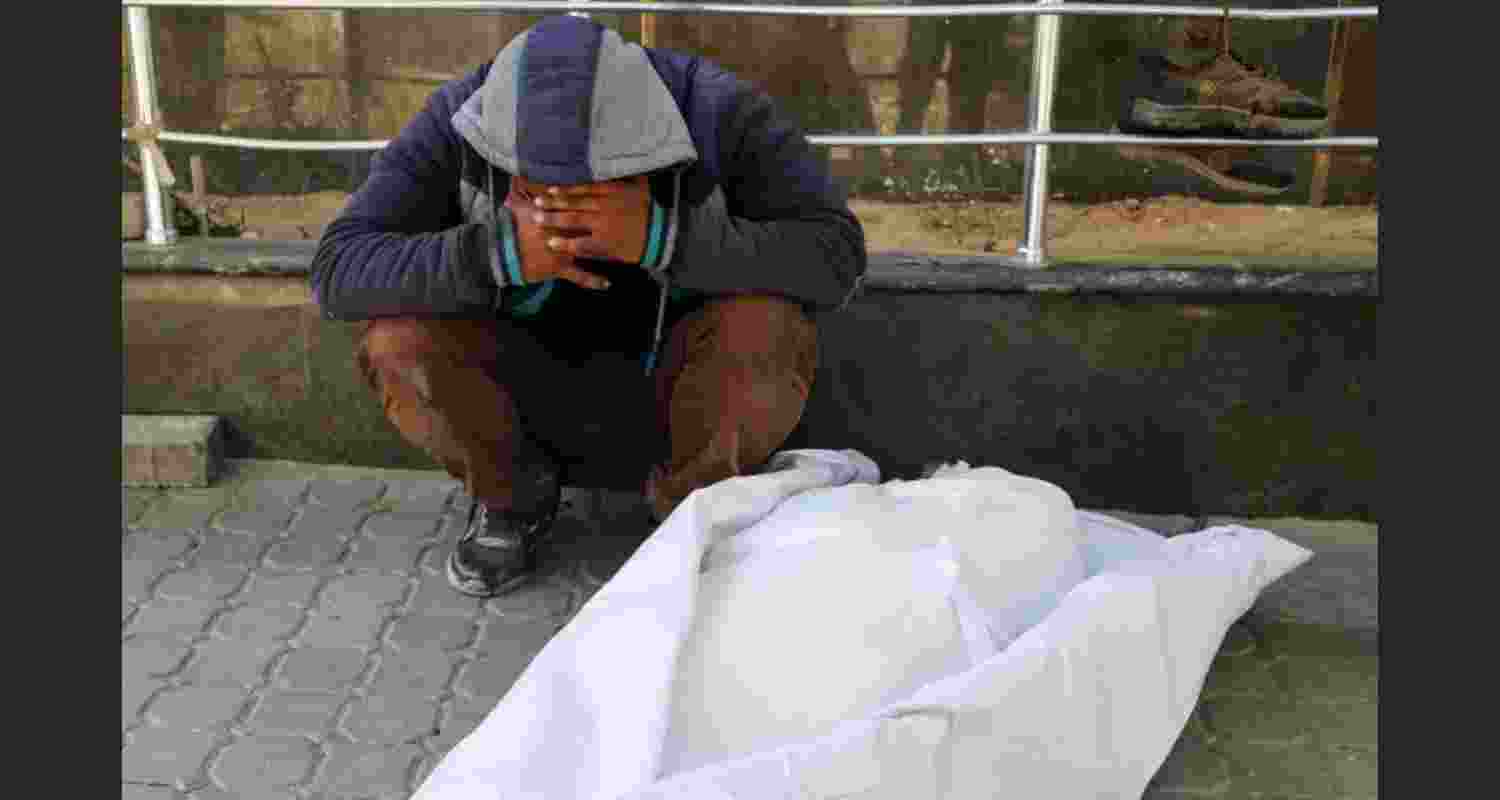 A mourner reacts next to the body of a Palestinian killed in Israeli strikes, at al-Shifa Hospital in Gaza. A mourner reacts next to the body of a Palestinian killed in Israeli strikes, at al-Shifa Hospital in Gaza.