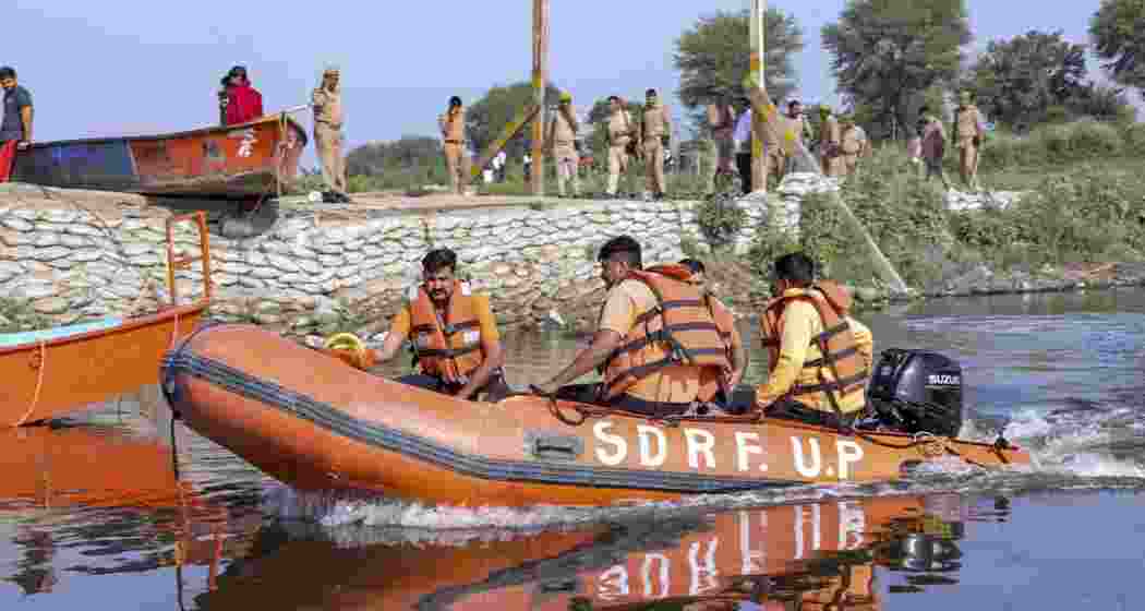 SDRF personnel during a search operation in the Yamuna river after a boat carrying pilgrims capsized on Friday, near Kesi Ghat, in Mathura district, on Saturday. SDRF personnel during a search operation in the Yamuna river after a boat carrying pilgrims capsized on Friday, near Kesi Ghat, in Mathura district, on Saturday.