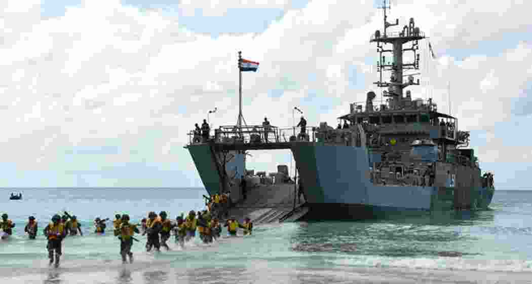 Soldiers deboard an amphibious vessel of the Indian Navy. Soldiers deboard an amphibious vessel of the Indian Navy.