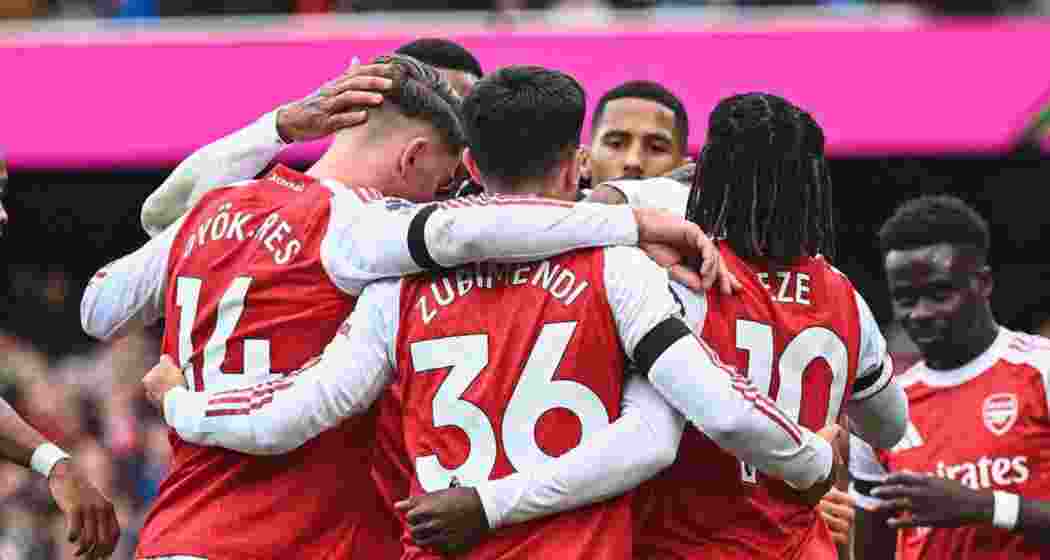 Arsenal players celebrate their win. Arsenal players celebrate their win.