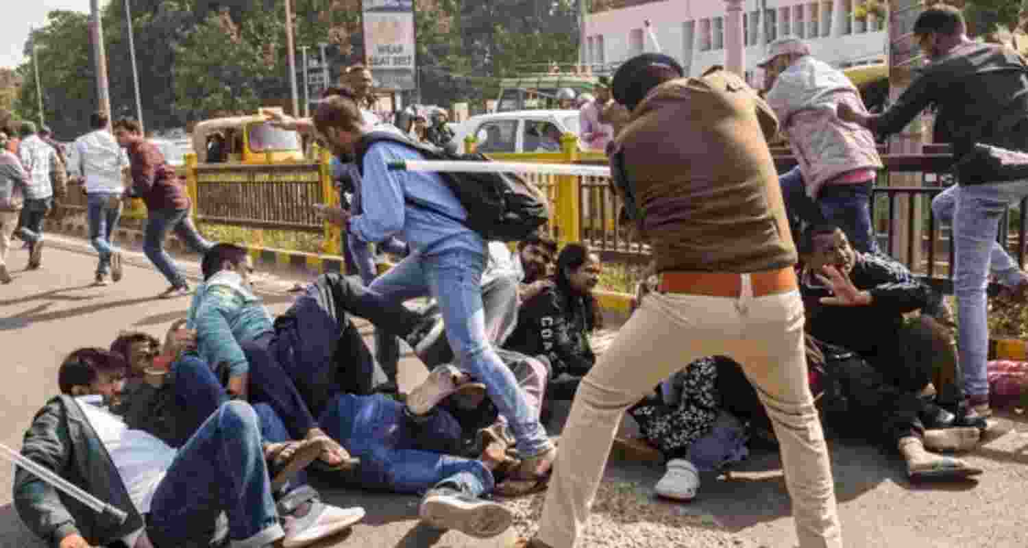 A police official lathicharges aspirants during their protest over normalisation of the 70th Bihar Public Service Commission (BPSC) examination in Patna. A police official lathicharges aspirants during their protest over normalisation of the 70th Bihar Public Service Commission (BPSC) examination in Patna.